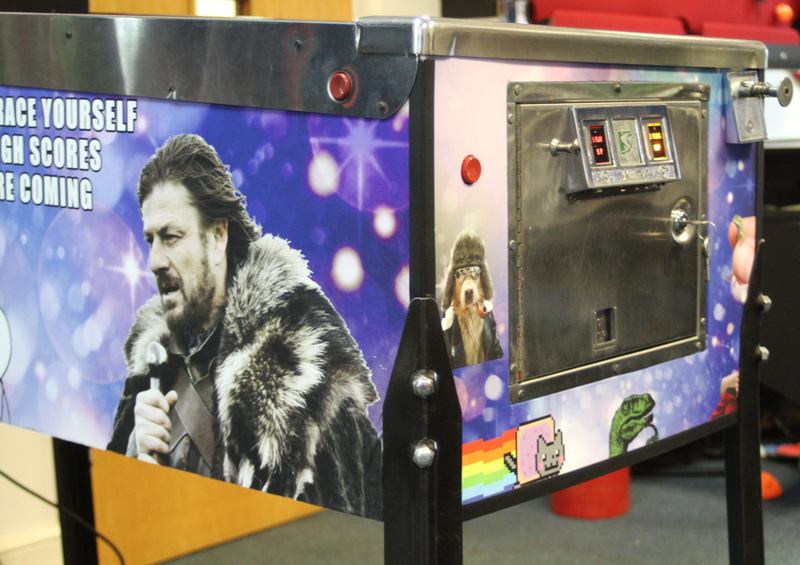Illustration for article titled The present bounces against the past in this meme-themed pinball table